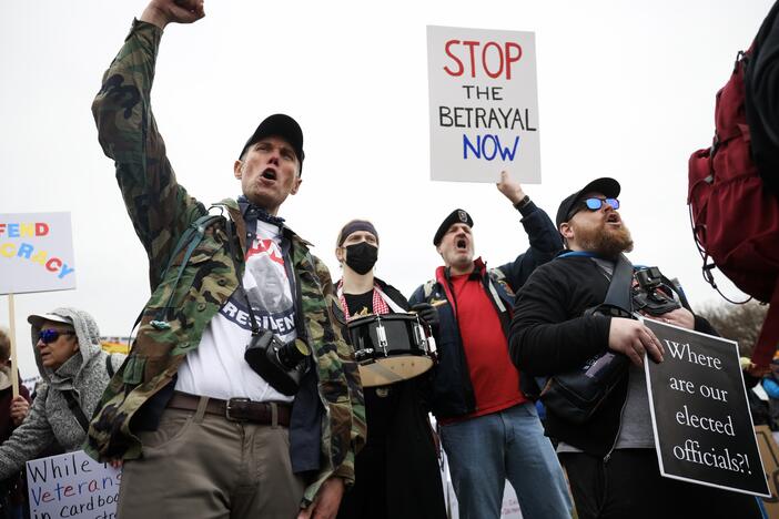 Veterans marched in on the National Mall in D.C. on March 14 to protest President Trump and Elon Musk's plans to cut more than 70,000 workers from the Department of Veterans Affairs.