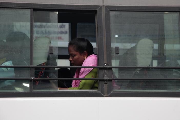 A woman sits on a bus in Sriperumbudur district in the southern Indian state of Tamil Nadu, where many women are employed in manufacturing. India hopes to attract more business as the Trump administration imposes tariffs on China.