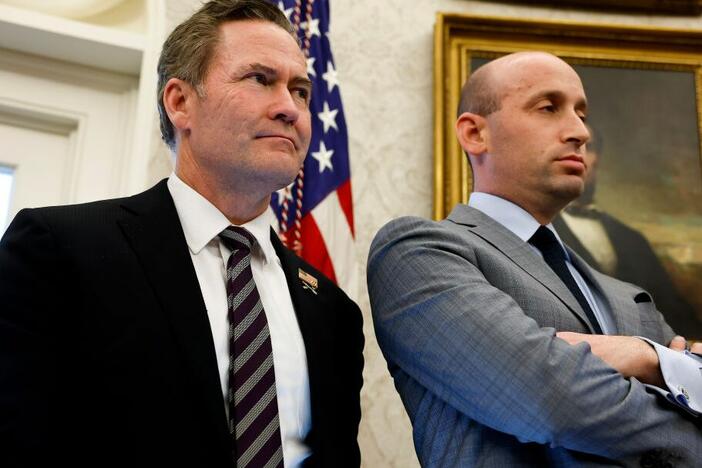 U.S. National Security Adviser Michael Waltz (L) and Deputy White House Chief of Staff for Policy Stephen Miller (R) look on as U.S. Pres. Donald Trump speaks with reporters after signing two executive orders in the Oval Office of the White House on Feb. 04, 2025. (Photo by Anna Moneymaker/Getty Images)