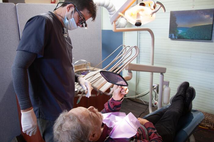 James Flanagin, the only dentist in Leslie, Ark., treats David Potts.  About 25 million Americans live in dentist shortage areas, according to new research from Harvard University.