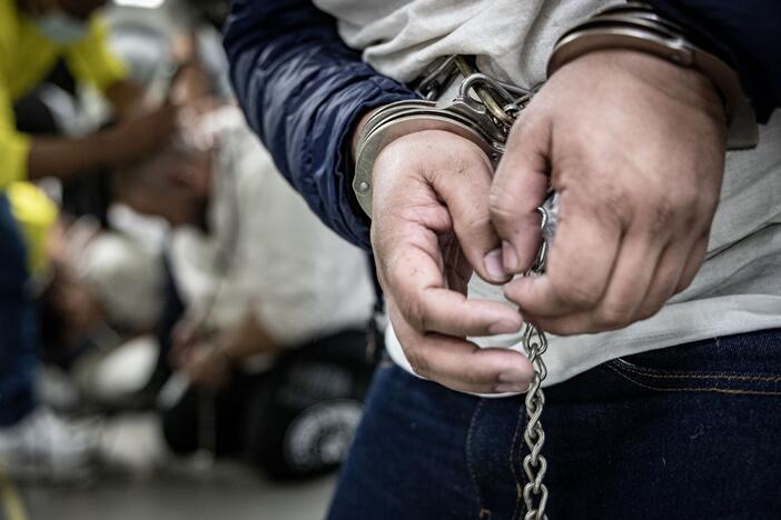 In this handout photo provided by the Salvadoran government, a close view of handcuffs placed on the hands of a newly admitted inmate allegedly linked to criminal organizations at CECOT on March 16, 2025 in Tecoluca, El Salvador. Trump's administration managed to deport some people to El Salvador under the Alien Enemies Act, the same day a judge ordered deportations under the Act paused.