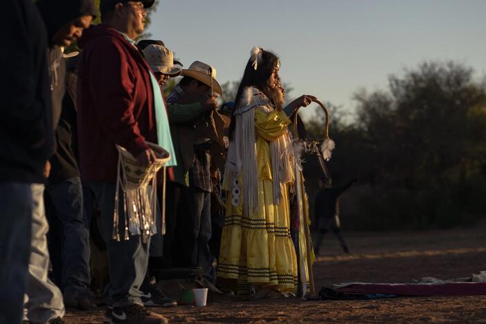 Lillian Begay and singers welcome the sunrise during her Apache Sunrise Dance.