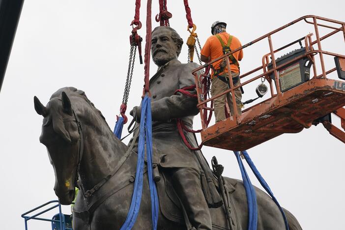A towering statue of Confederate General Robert E. Lee is removed in Richmond, Va., in September 2021. It was one of many monuments and statues to Confederate leaders removed or relocated following protests after George Floyd's murder in 2020.