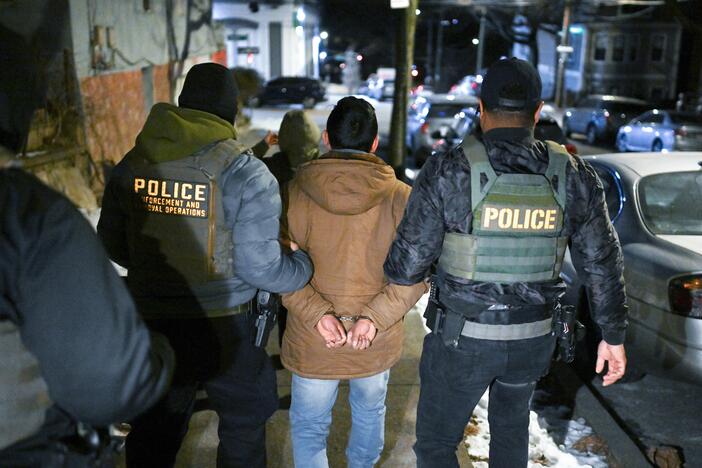 Law enforcement walk with Leonardo Fabian Cando Juntamay as he was detained in the Bronx during ICE-led operations to apprehend illegal immigrants on Jan. 28, 2025 in New York, NY.