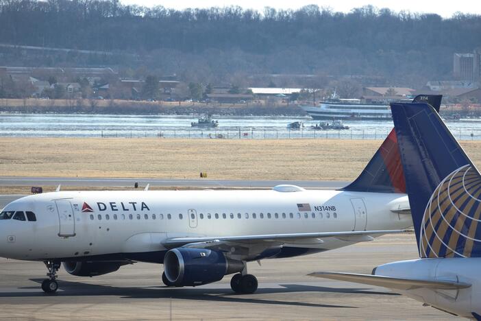 A Delta Air Lines plane taxis to its gate at Ronald Reagan Washington National Airport after landing on Jan. 30 in Arlington, Va.