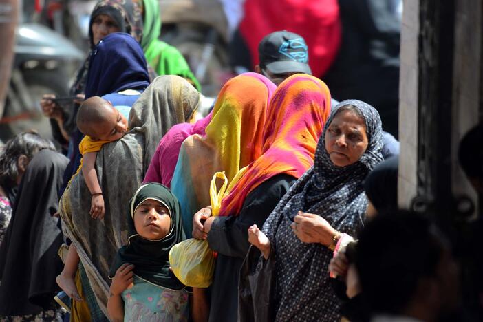 People beg for charity at Karachi's New Memon Mosque as large numbers arrive in Pakistan's biggest city from all over Sindh province to bring in extra money during the month of Ramadan, March 28.