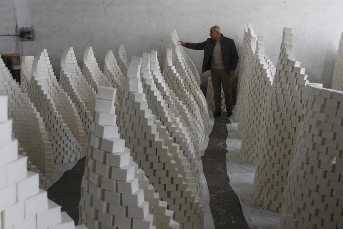 Ahmad Dwikat, a Palestinian worker, inspects bars of soap stacked to dry before packing them at a soap factory in the West Bank city of Nablus, on March 1.
