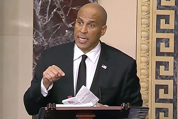 Sen. Cory Booker speaks on the Senate floor on Tuesday morning. He took the podium at 7 p.m. Monday night and promised to stay there as long as physically possible.