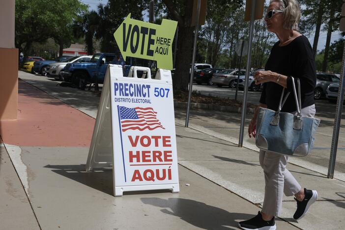 A sign directs voters to cast their ballots at a polling station set up at the Flagler County Public Library on Tuesday. Republicans won special elections in two Florida Congressional districts. The margins of victory in the heavily-Republican districts were significantly narrower than in November.