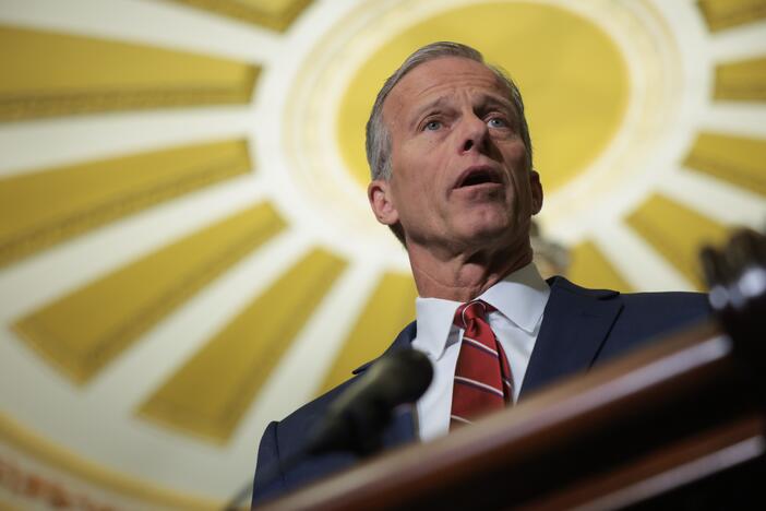 Senate Majority Leader John Thune, R-S.D., speaks to reporters at the U.S. Capitol on Tuesday. Senate Republicans have unveiled a budget blueprint they hope to pass as they look to enact key elements of President Trump's domestic policy agenda.