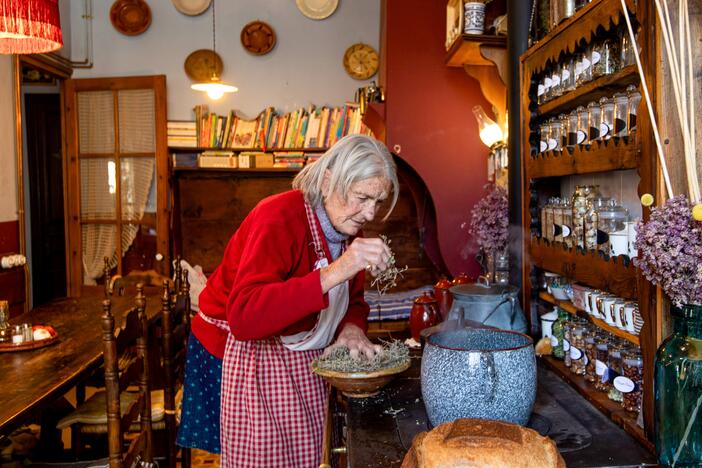 Angela Farre Palacin, 87, adds thyme to the boiling water for <em>sopa de farigola</em>, a traditional soup in Catalonia, Spain.