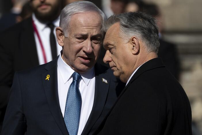 Israeli Prime Minister Benjamin Netanyahu, left, and Hungarian Prime Minister Viktor Orban, right, talk after a welcoming ceremony with a guard of honor at Buda Castle in Budapest, Hungary, on Thursday.