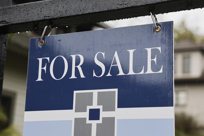 A 'For Sale' sign is posted in front of a home for sale last month in Pasadena, Calif.