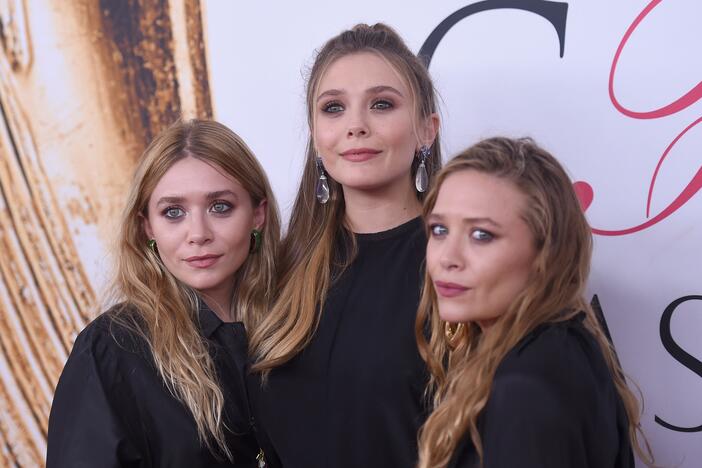 Elizabeth Olsen (center) and Mary-Kate and Ashley Olsen attend the 2016 CFDA Fashion Awards at the Hammerstein Ballroom in June 2016 in New York City.