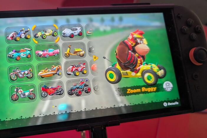 A Nintendo Switch 2 console playing Mario Kart World at a hands-on event in New York City.