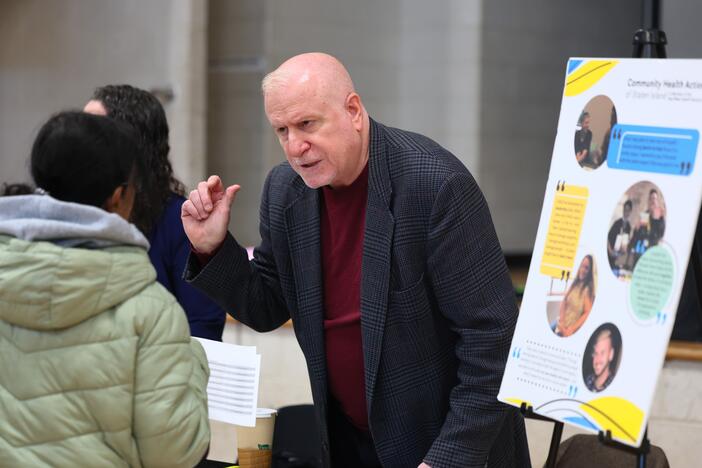 Employers speak with attendees during a job fair at the YMCA Gerard Carter Center in Staten Island in New York City on March 27, 2025. Employers continued to add jobs in March, but uncertainty over trade policy and softer spending by consumers could soon be a drag on hiring.