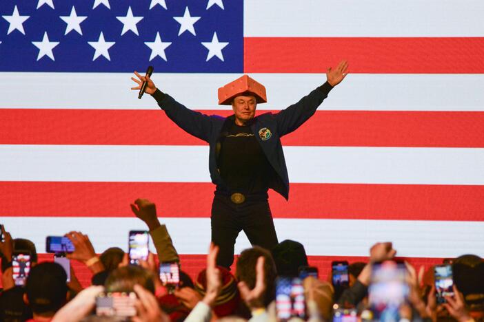 Elon Musk wears a cheesehead hat as he speaks during a rally in Green Bay, Wisc. on March 30, 2025. An election to choose a new state Supreme Court justice takes place Tuesday and Musk has contributed millions to the race, hoping to secure a win for the conservative candidate.