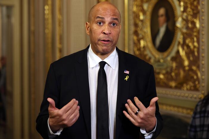 Sen. Cory Booker speaks to reporters as he leaves the Senate chamber after delivering a record-setting floor speech on Tuesday. Contrary to popular belief, the speech was not technically a filibuster.