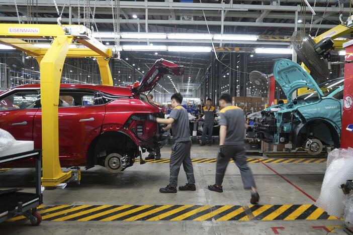Workers assemble electric cars at a Vinfast factory in Hai Phong, Vietnam, on Sept. 29, 2023.