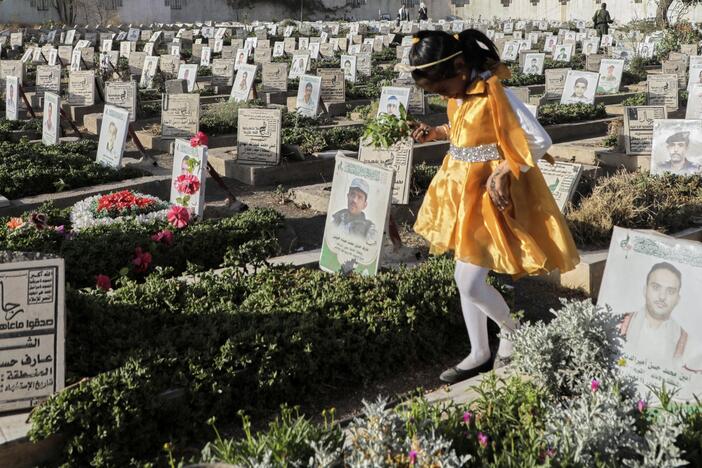 A Yemeni girl visits the graves of Houthis during Eid al-Fitr marking the end of the holy fasting month of Ramadan in Sanaa, Yemen, Sunday, March 30, 2025.