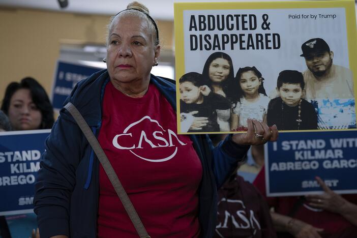 Supporters hold up signs as Jennifer Vasquez Sura, the wife of Kilmar Abrego Garcia of Maryland, who was mistakenly deported to El Salvador, speaks during a news conference at CASA's Multicultural Center in Hyattsville, Md., Friday, April 4.