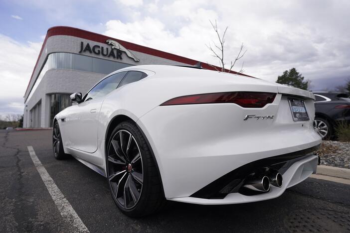 FILE - An unsold 2021 F-Type coupe sits at a Jaguar dealership in this photograph taken Sunday, May 2, 2021, in Littleton, Colo.