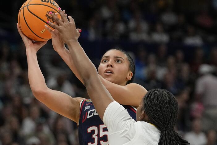 UConn guard Azzi Fudd (35) shoots against South Carolina forward Sania Feagin (20) during the first half of the national championship game of the women's NCAA college basketball tournament on Sunday in Tampa, Fla.