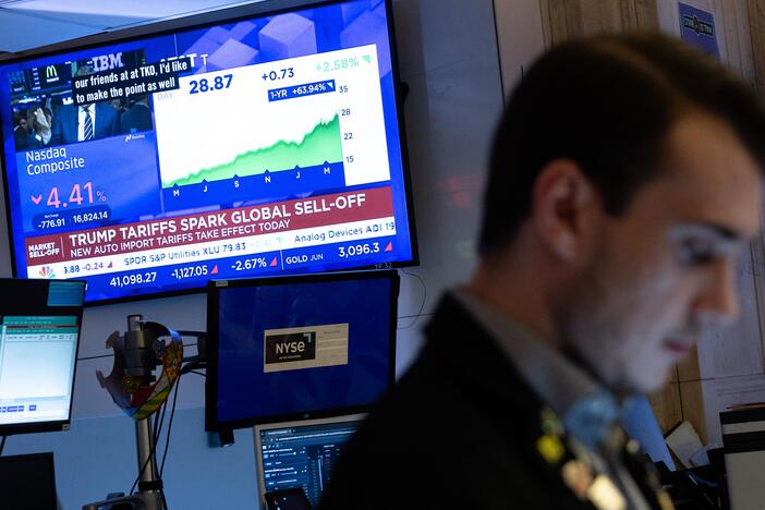 Traders work on the floor of the New York Stock Exchange on Thursday, which saw the worst markets selloff in five years.