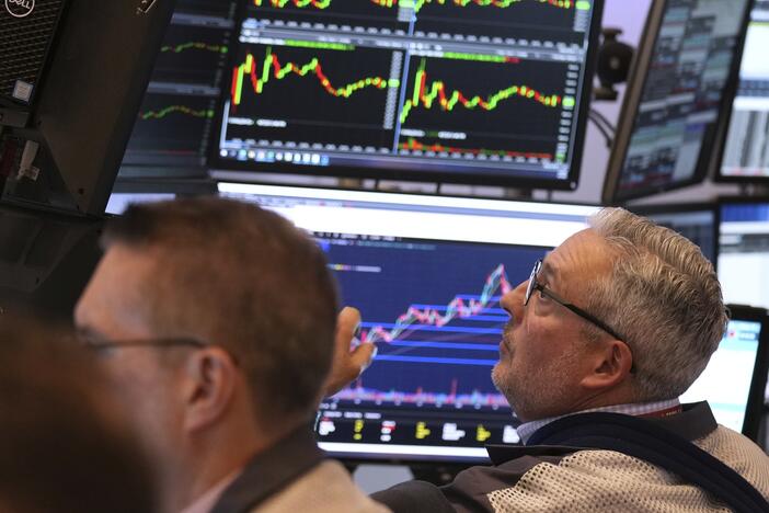 Traders work on the floor Monday at the New York Stock Exchange in New York.