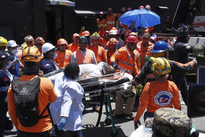 Rescue workers carry a person pulled from the wreckage of the Jet Set nightclub after its roof collapsed during a merengue concert in Santo Domingo, Dominican Republic, Tuesday, April 8, 2025.