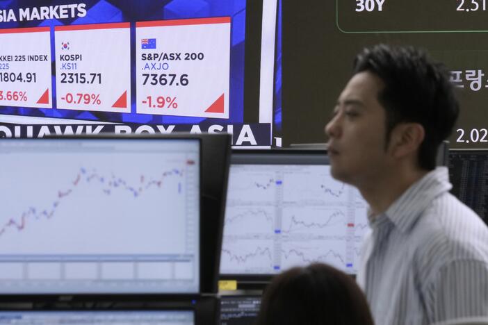 A currency trader works at the foreign exchange dealing room of the KEB Hana Bank headquarters in Seoul, South Korea, on Wednesday.