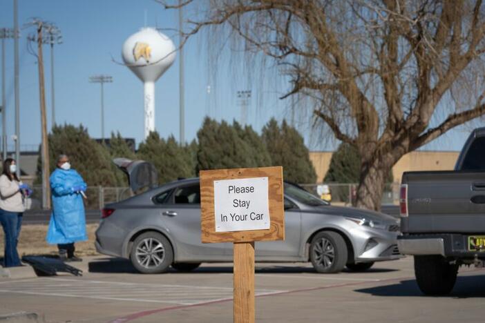 Signs point the way to measles testing in the parking lot of the Seminole Hospital District across from Wigwam Stadium on February 27, 2025 in Seminole, Texas.