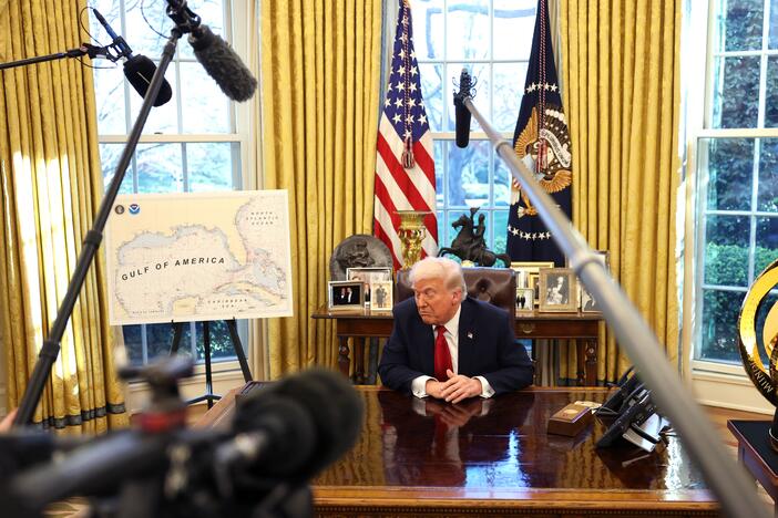 President Trump speaks to the press in the Oval Office next to a map of what he has renamed the "Gulf of America" on March 26. The administration has denied the Associated Press access to such events because it calls the body of water the "Gulf of Mexico," even as it acknowledges his preferred designation.