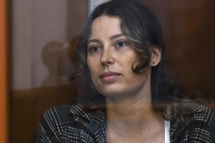 Ksenia Karelina, also known as Khavana sits in a glass cage in a court room in Yekaterinburg, Russia, Thursday, June 20, 2024.