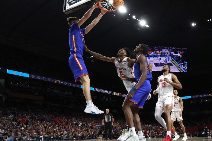 Alex Condon #21 of the Florida Gators dunks the ball against Joseph Tugler #11 of the Houston Cougars during the second half in the National Championship of the NCAA Men's Basketball Tournament at the Alamodome on Monday in San Antonio, Texas. Florida defeated Houston to win its third title.