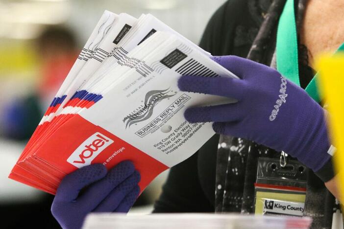 An election worker sorts vote-by-mail ballots for the presidential primary at King County Elections in Renton, Wash., in March 2020.