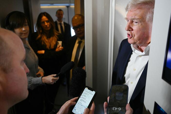 President Trump takes questions from reporters on Air Force One on April 11, 2025.