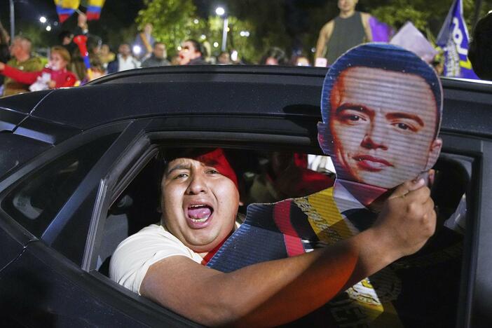 Supporters of President Daniel Noboa celebrate early returns showing him in the lead in the presidential election runoff in Quito, Ecuador, Sunday, April 13, 2025.