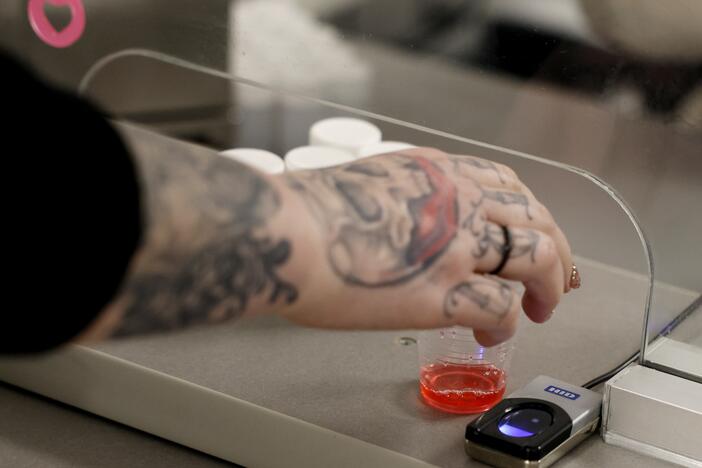 A woman reached for a dose of methadone at the Behavioral Health Network opioid treatment clinic.