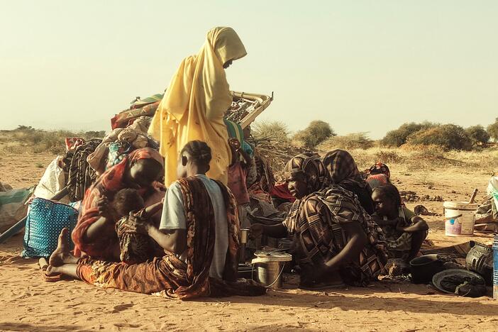 Displaced Sudanese, who fled the Zamzam camp, gather near the town of Tawila in North Darfur