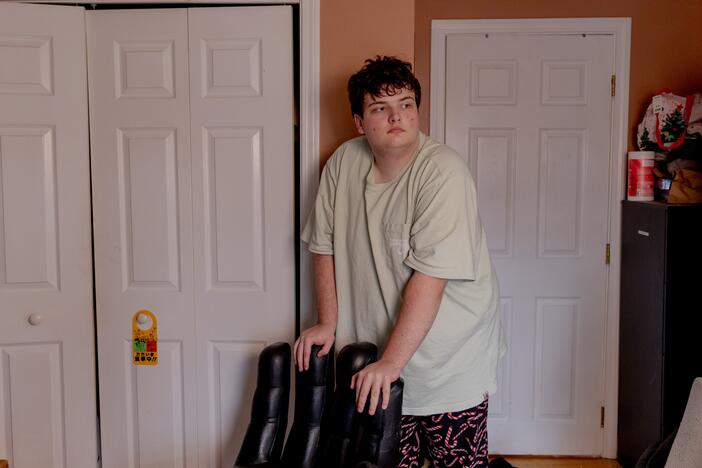 Logan, 17 and a junior at Newton South High School, stands in his room in Newton, Mass. Logan was part of a program called Charting My Path, which helps students with disabilities prepare for life after high school. The Trump administration cancelled the program in February. <br>