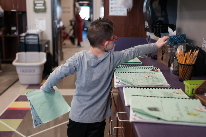 Kellen Hedler prepares to start his school day at Frontier Elementary School in Edmond, Okla.