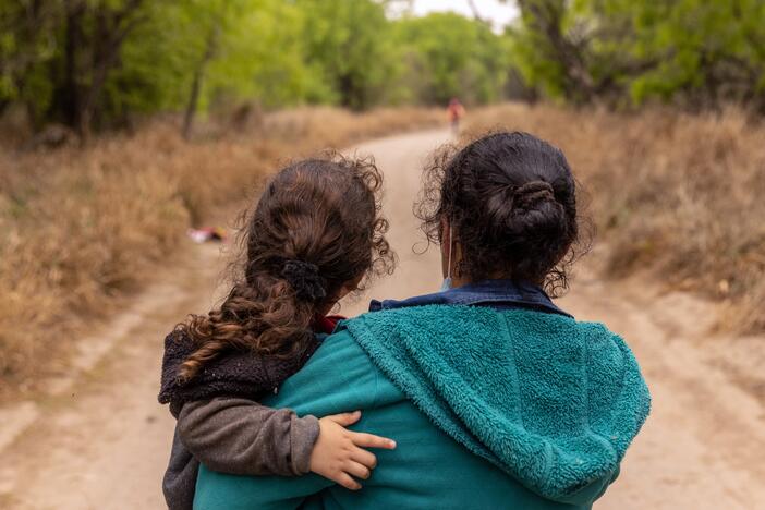 Asylum-seekers from Honduras walk toward a U.S. Border Patrol checkpoint after crossing the Rio Grande from Mexico in 2021 near Mission, Texas.