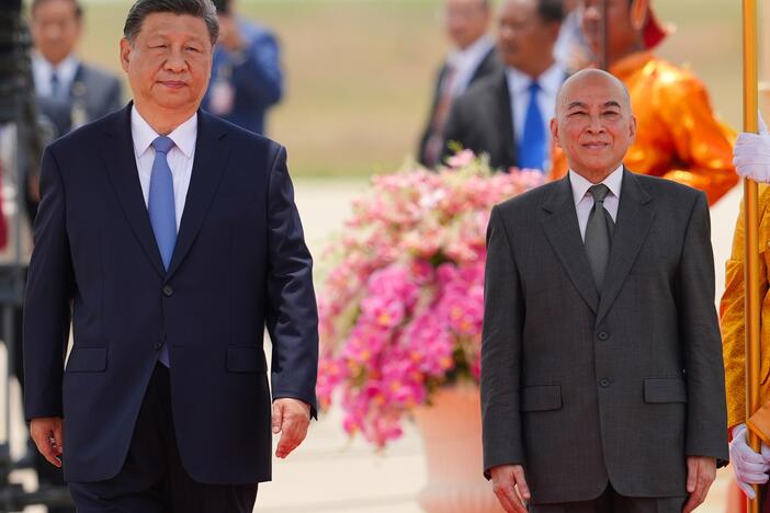 In this photo released by Agence Kampuchea Press (AKP), Cambodia's King Norodom Sihamoni, right, and Chinese President Xi Jingping attend a welcome ceremony at Phnom Penh International Airport in Phnom Penh, Cambodia, Thursday, April 17, 2025. (AKP via AP)