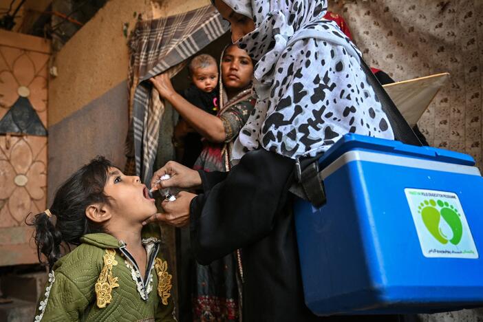 A health worker in Karachi administers polio drops — the oral vaccine — on February 3, the first day of a nationwide polio vaccination campaign. The country, one of only two where wild polio circulates, has seen a rise in cases due to issues with vaccination campaigns.