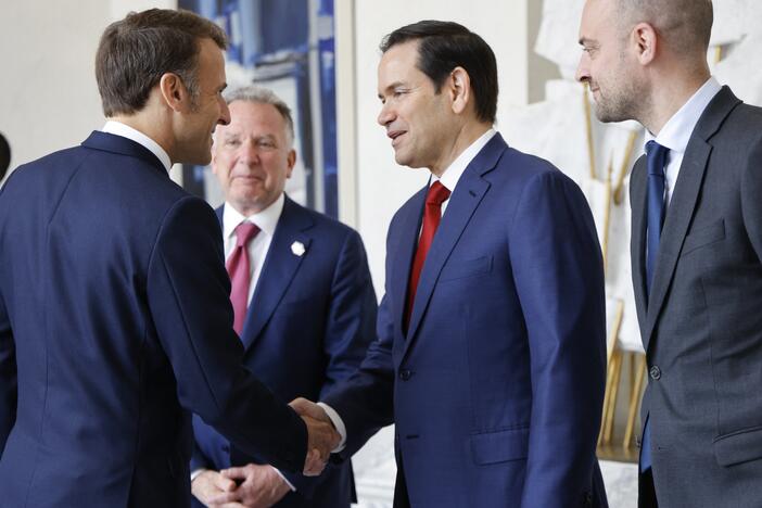 French President Emmanuel Macron (left) shakes hands with U.S. Secretary of State Marco Rubio next to special envoy Steve Witkoff (center) and France's foreign minister, Jean-Noël Barrot, before a meeting at the Élysée presidential palace in Paris on Thursday.