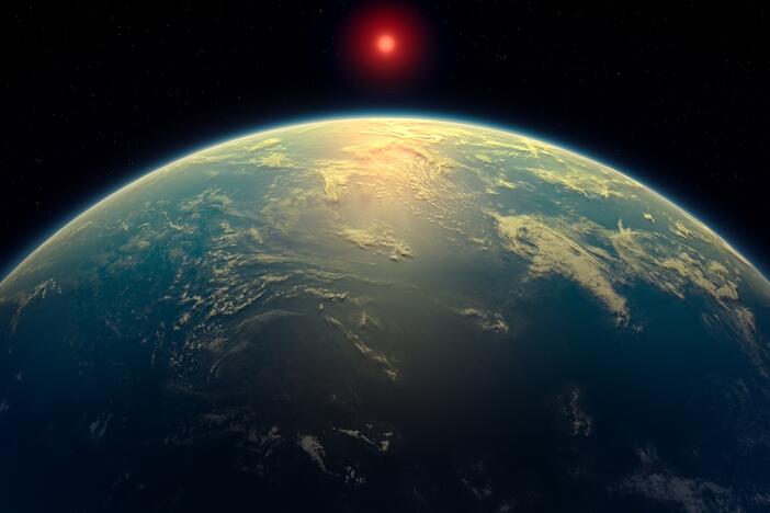 This artist's impression depicts what a water world with a hydrogen atmosphere, such as planet K2-18b, might look like.