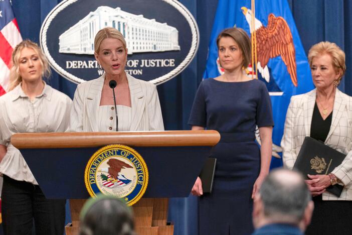 Attorney General Pam Bondi spoke at the Justice Department on Wednesday to announce that the administration is suing Maine for not complying with the government's push to ban transgender athletes in girls sports. She was accompanied by (from left) Riley Gaines, Rep. Laurel Libby, R-Maine, and Education Secretary Linda McMahon.