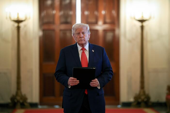 President Trump arrives for a presentation ceremony for the Commander-in-Chief Trophy to the U.S. Naval Academy in the East Room of the White House on Tuesday.