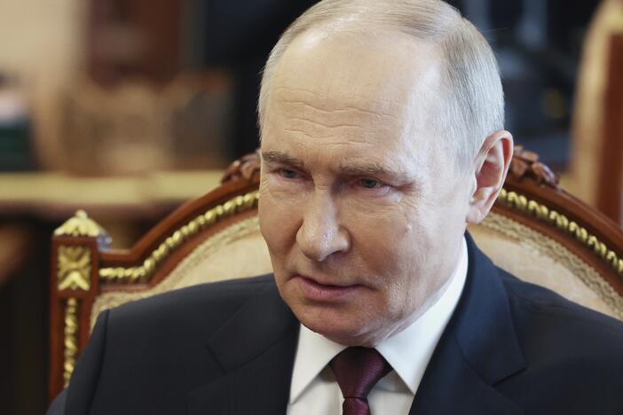 Russian President Vladimir Putin speaks with Russian Chief of General Staff Gen. Valery Gerasimov during their meeting at the Kremlin in Moscow on Saturday.